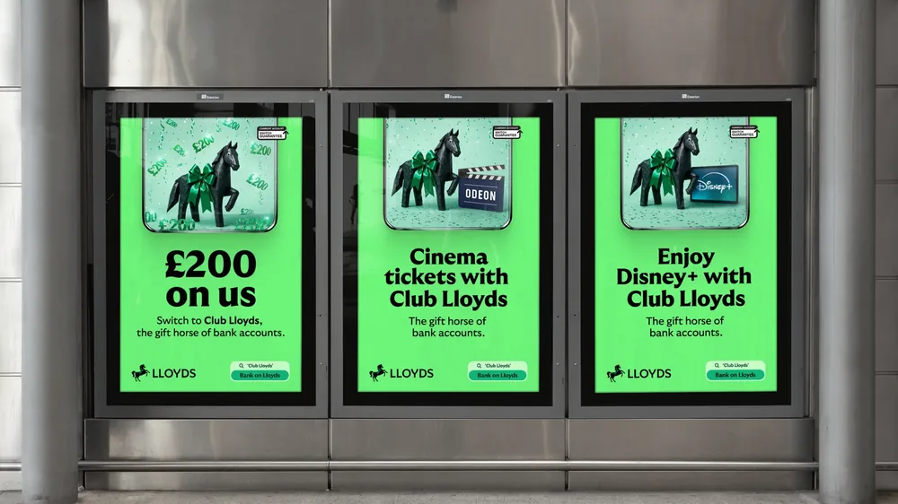 Three Club Lloyds digital screens in a station: £200 on us, cinema tickets with ODEON, and Disney+