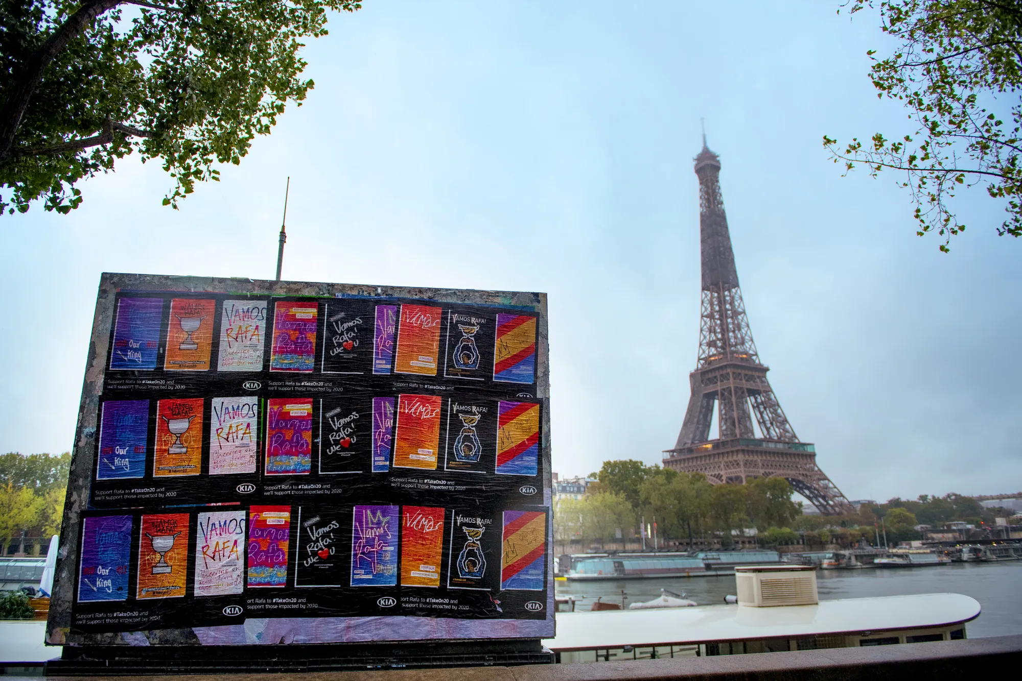 Kia #TakeOn20: wall of 'Vamos Rafa' posters by the Seine, Eiffel Tower behind